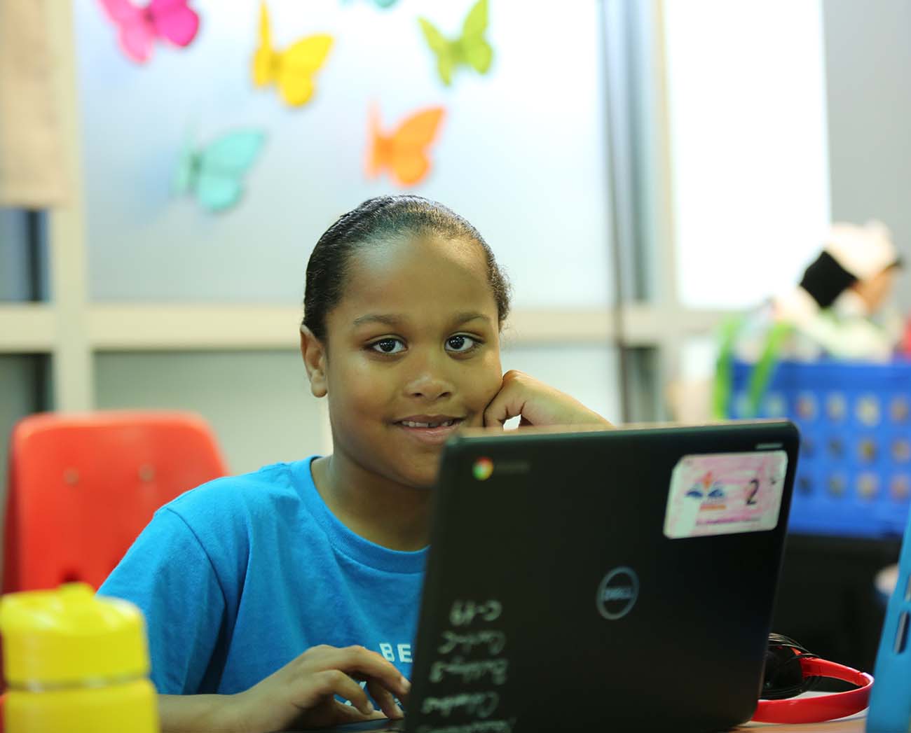 Smiling children together outdoors.